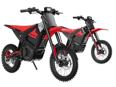 Two red and black electric dirt bikes shown on a clean white background, with one in the foreground and a second angled bike behind it.